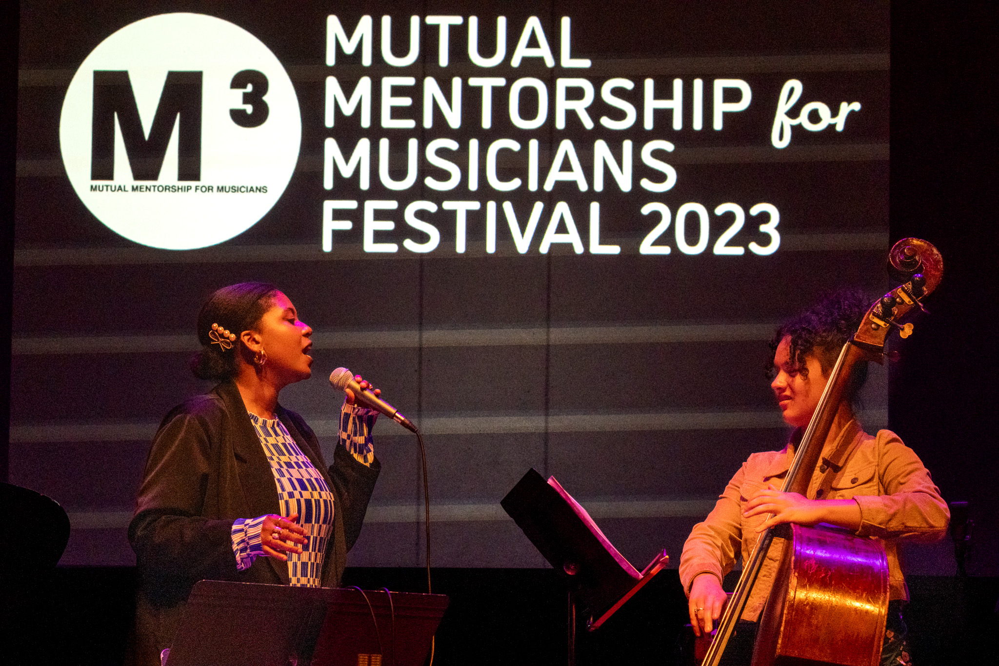 Gabi Motuba (voice) and Linny Mateo (bass), photo by Christopher Pelham