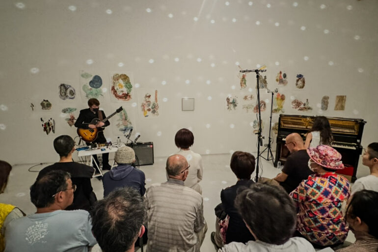 Shin'ichi Isohata 磯端伸 (guitar) & sara (piano, perc.) performing at the closing reception for Chie Matsui's exhibition 置き去られた鏡 The Forsaken Mirror at Gallery Nomart, Osaka, 4/20/24